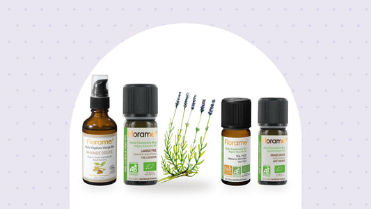 Huiles essentielles Florame de lavande fine, tea tree et orange douce, et huile végétale d'amande douce, sur fond lavande