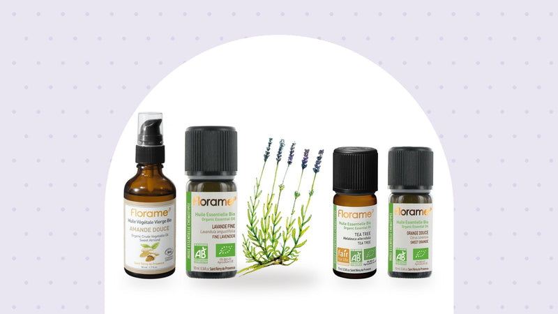 Huiles essentielles Florame de lavande fine, tea tree et orange douce, et huile végétale d'amande douce, sur fond lavande